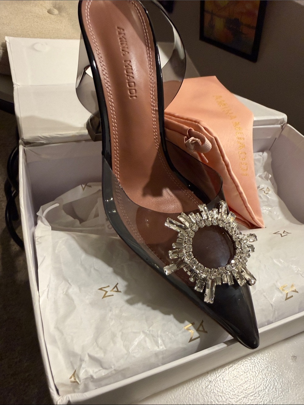 Amina Muaddi Black PVC Pointed Toe Pump with Crystal Sunburst Accent